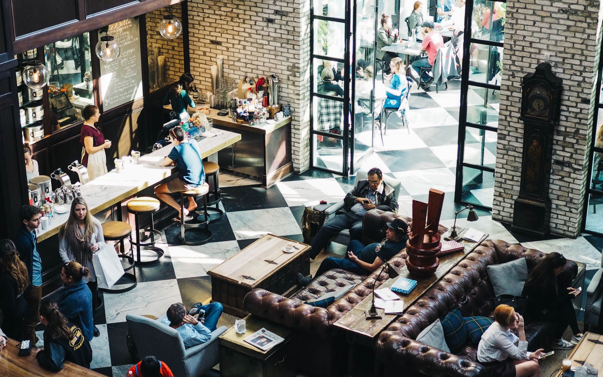 Aerial shot inside of people sitting inside a cafe